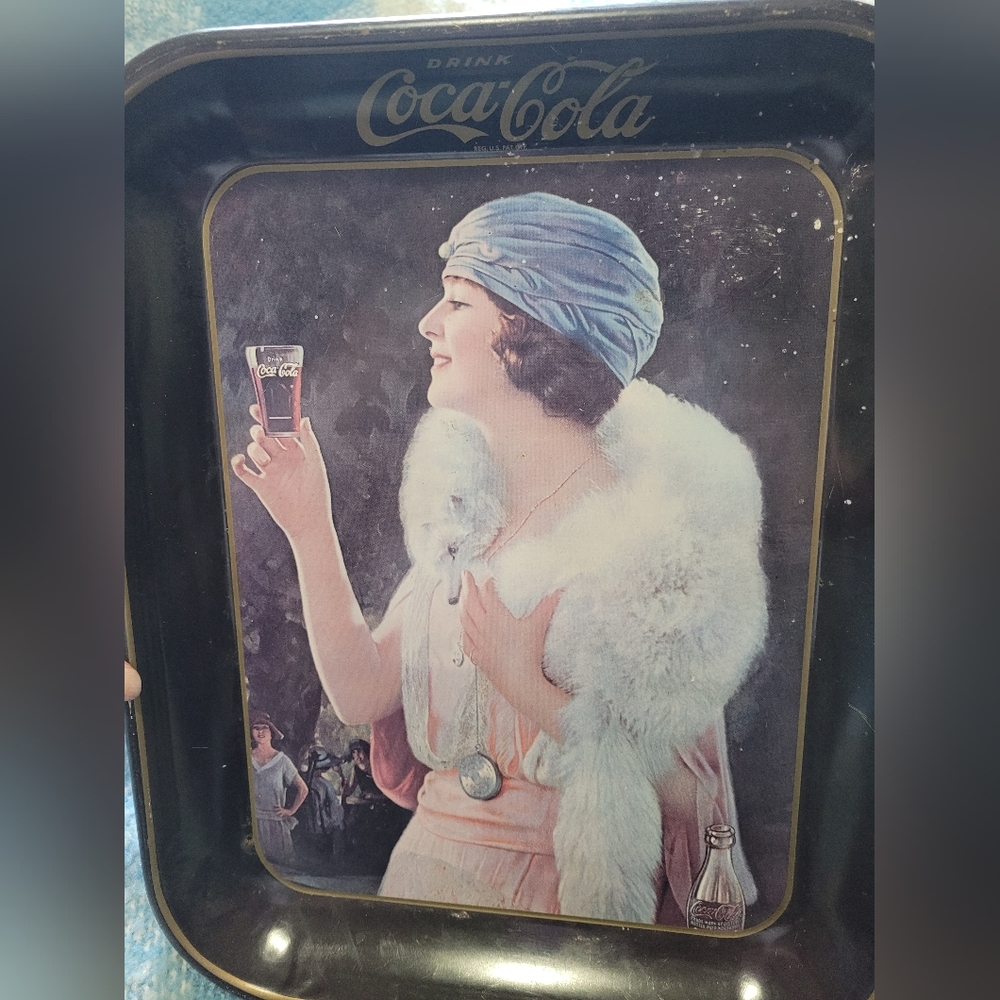 Vintage Coca-Cola tin wall art